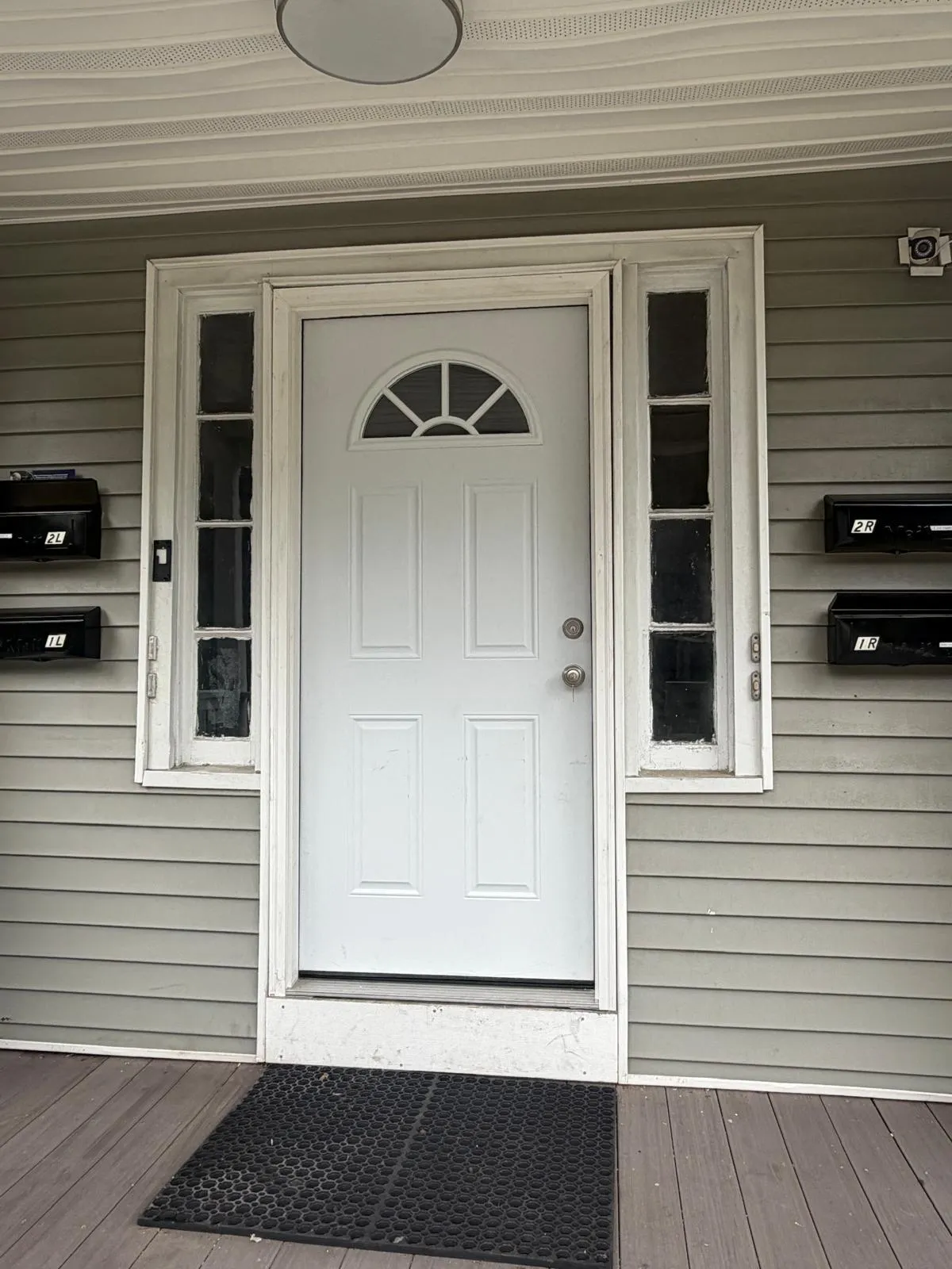 Front door with sidelights installed by Mosquera Construction in Connecticut