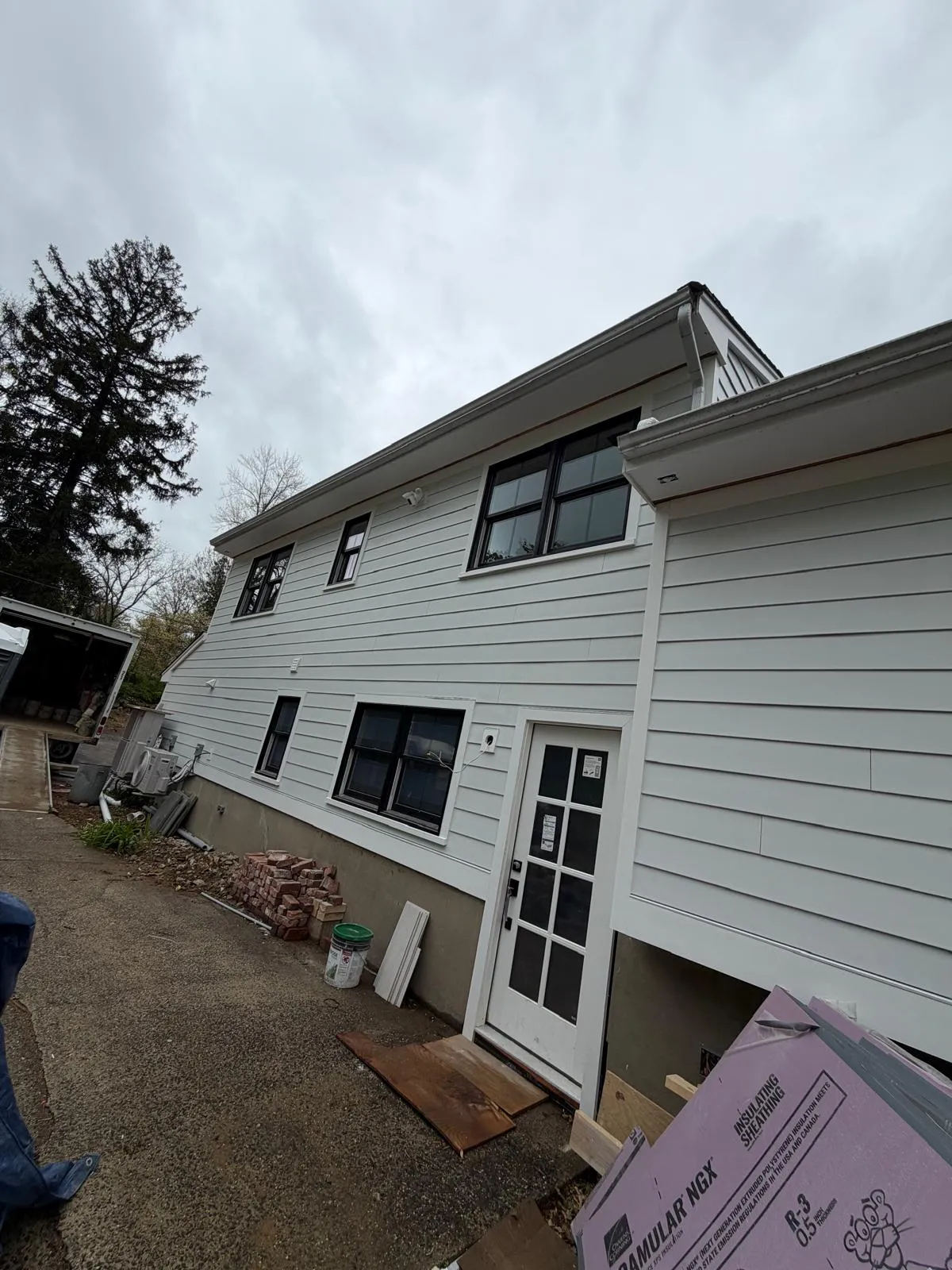 Home with finished white siding installed by Mosquera Construction in Connecticut