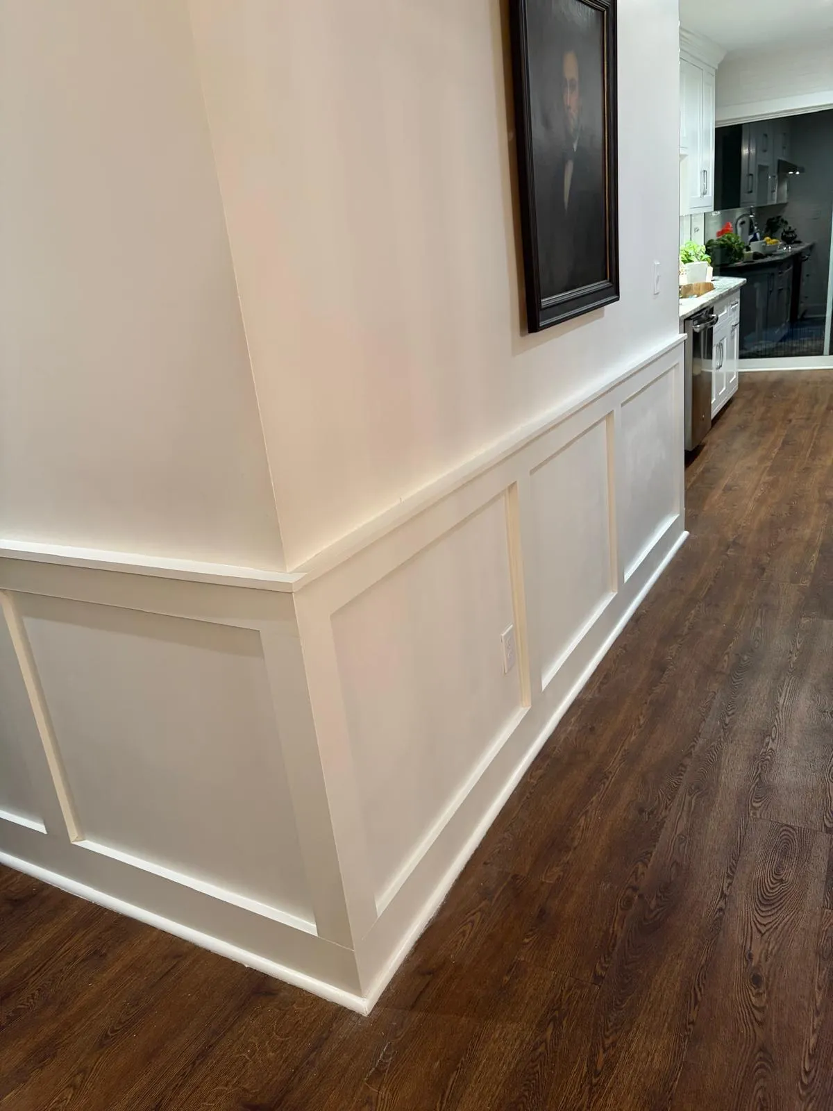 Hallway with white wainscoting painted by Mosquera Construction in Connecticut