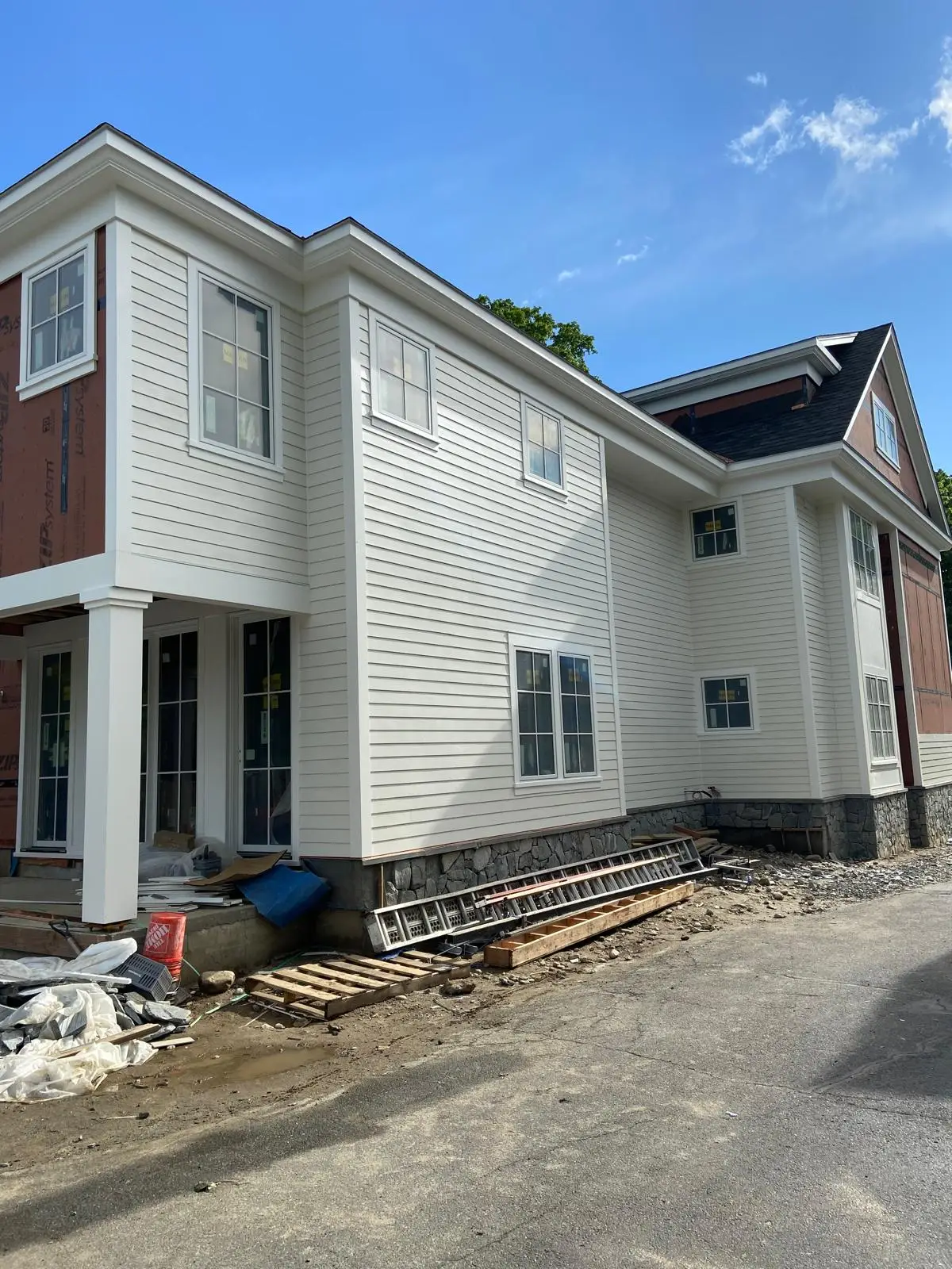 Home with finished light siding by Mosquera Construction in Connecticut