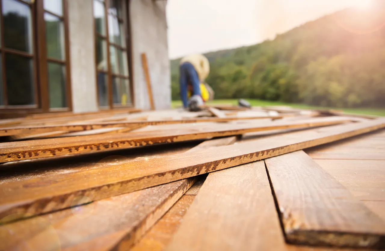 Worker building a new wooden deck