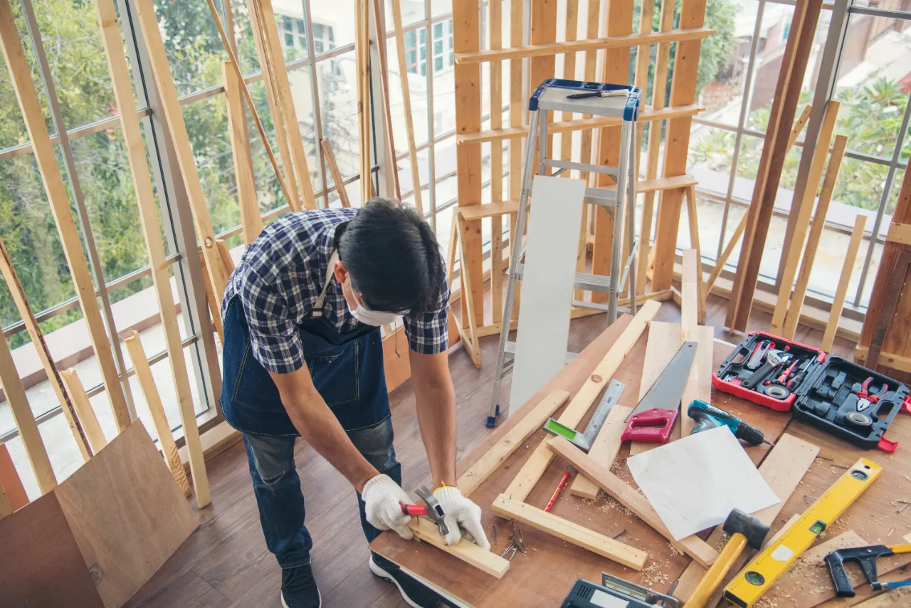 Carpenter working on a wood frame