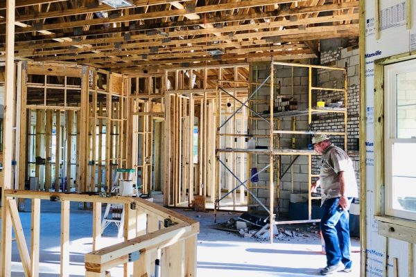 homeowner-walking-into-his-new-home-still-under-co-2024-11-28-13-23-58-utc